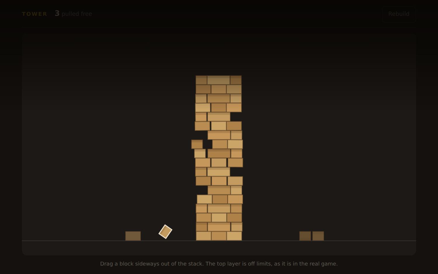 Tower — a stack of wooden blocks with gaps pulled out of it, leaning but still standing